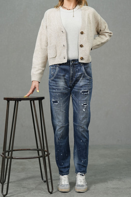 Jean bleu coupe slim en denim rigide avec effets usés et taches de peinture